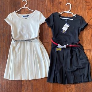 One off white, one black polo dresses for girls. Never worn.